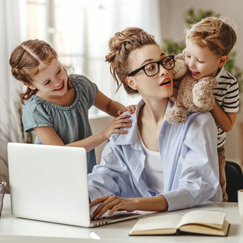 Mom distracted by small children while working from home