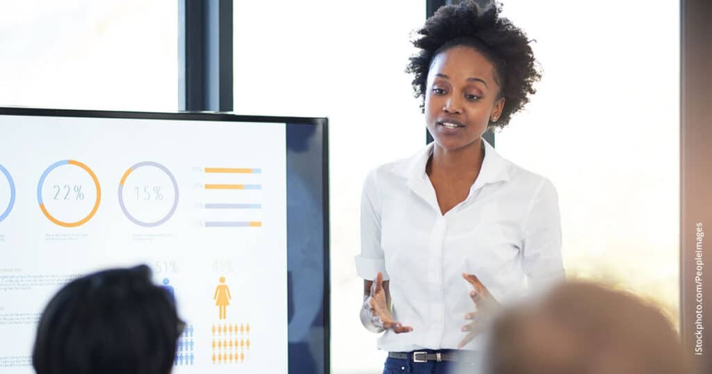 businesswoman giving a presentation a board meeting