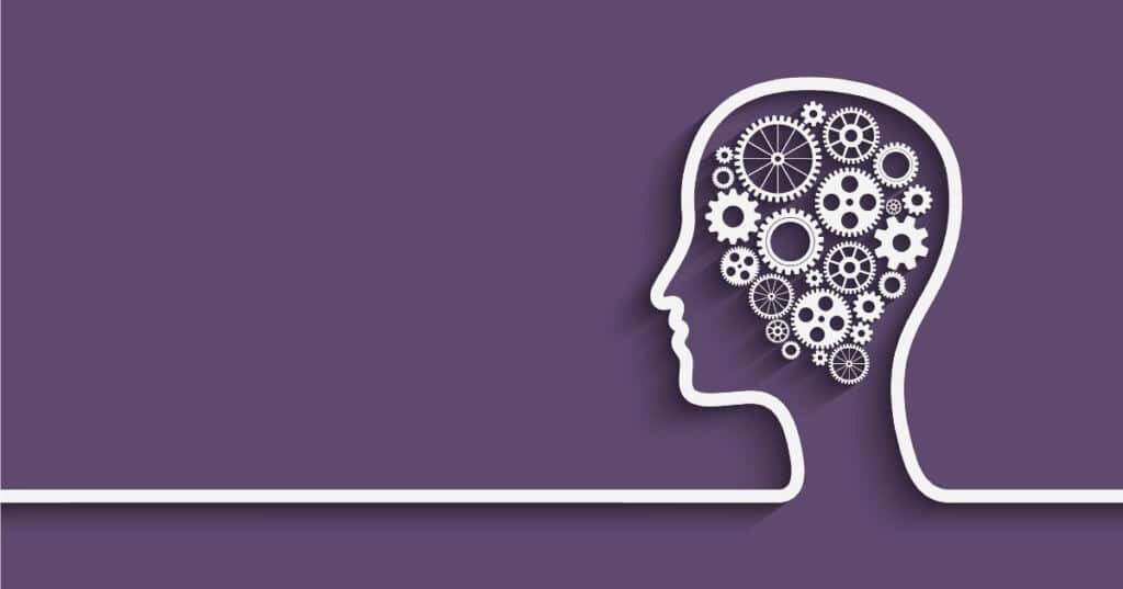 human head silhouette with gears on purple background