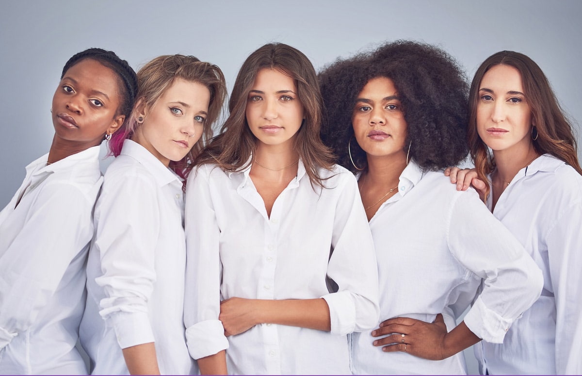 a group of diverse women standing together in unity